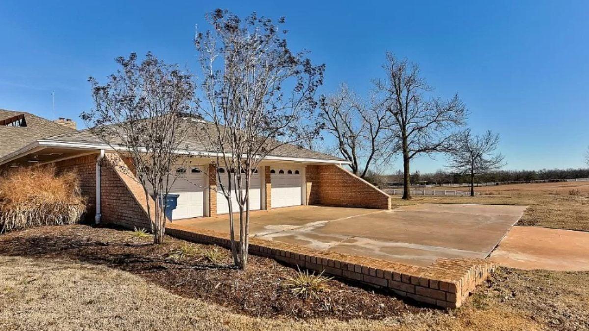 Explore the Spacious Garage and Classic Brickwork of This Ranch Home