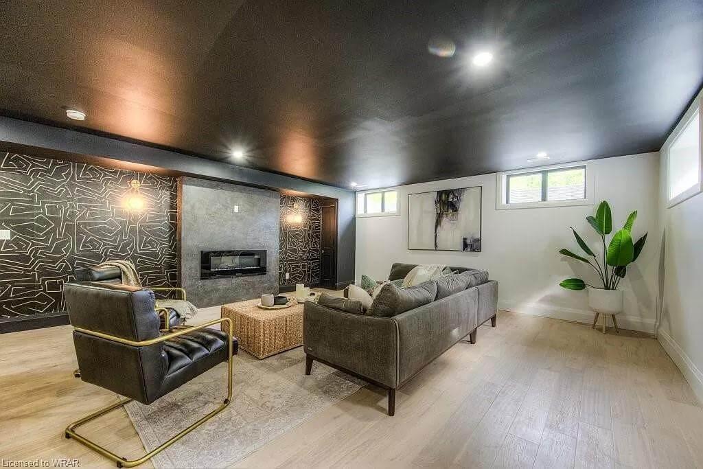 Sleek Basement Lounge with a Striking Geometric Feature Wall