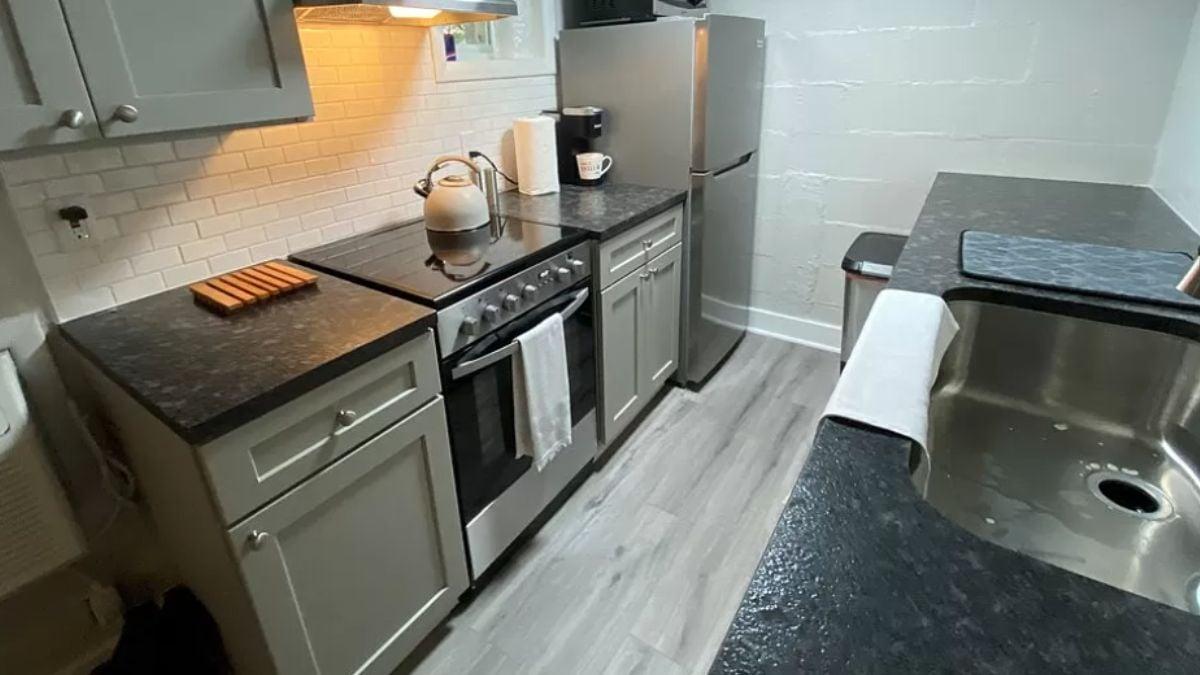 Notice the Under-Cabinet Lighting in This Sleek Craftsman Kitchen