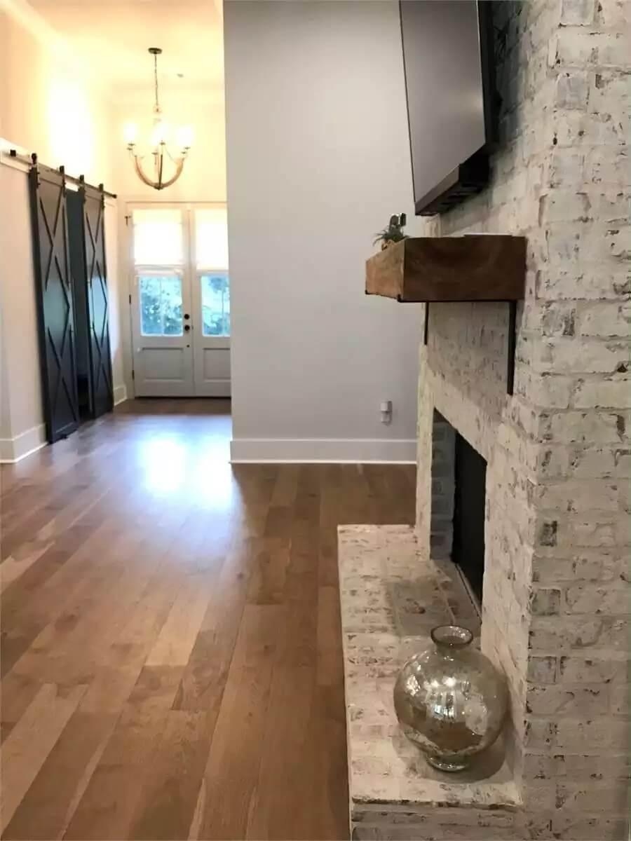 Rustic Fireplace Mantel with Striking Barn Door Detail