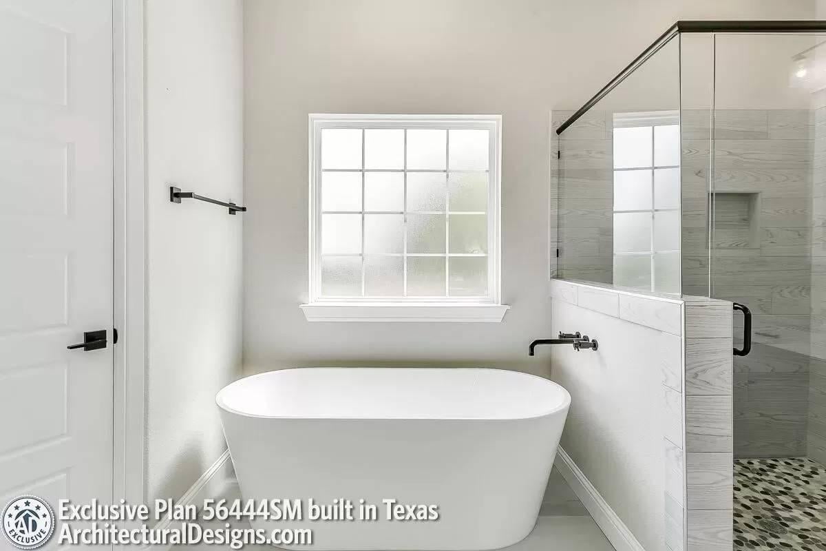 Minimalist Master Bath Featuring a Freestanding Tub Centerpiece