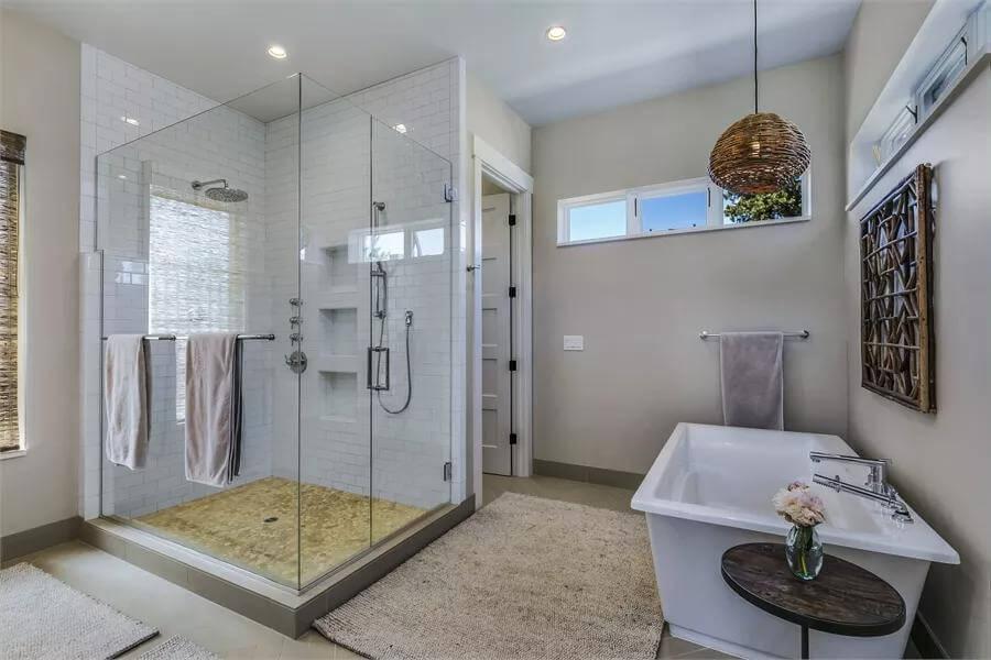 Inviting Bathroom with a Freestanding Tub and Woven Pendant Light