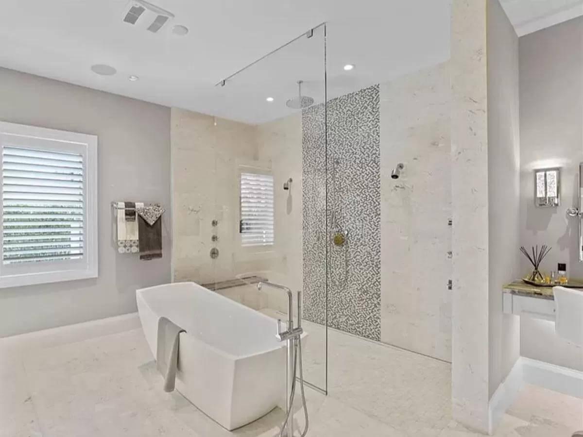 Admire the Freestanding Tub Paired with a Chic Glass Shower