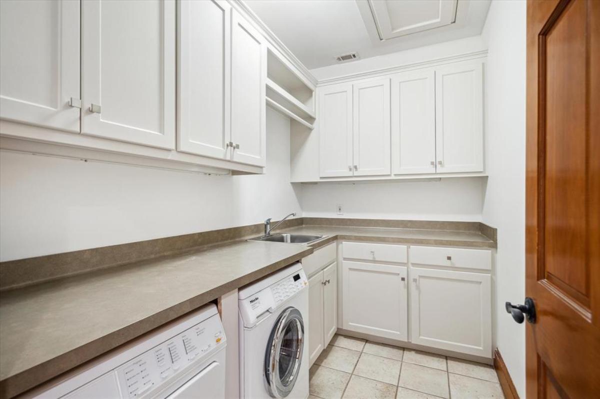 Efficient Craftsman Laundry Room with Ample Cabinetry