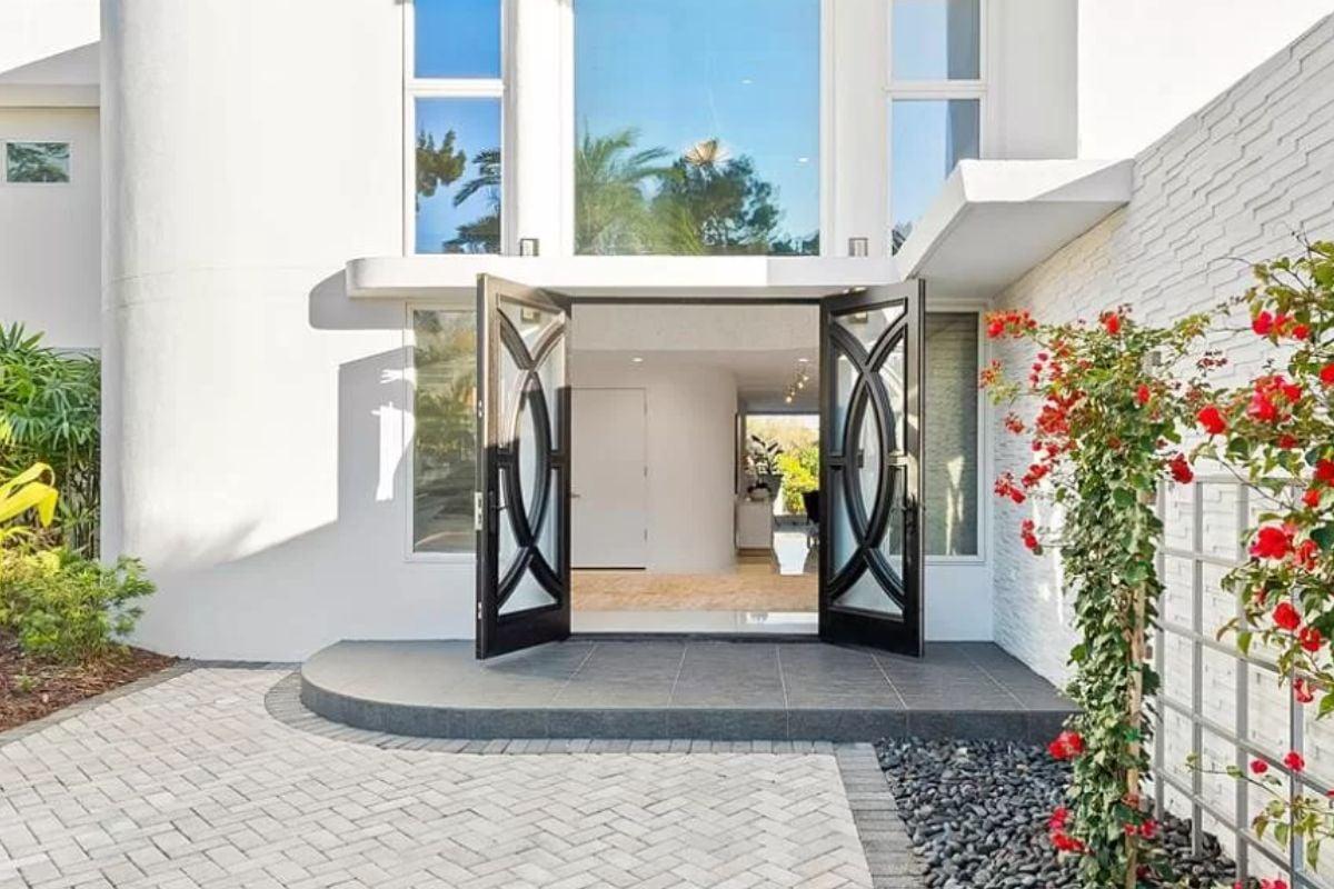 Step Through These Stunning Glass Doors Framed by Nature
