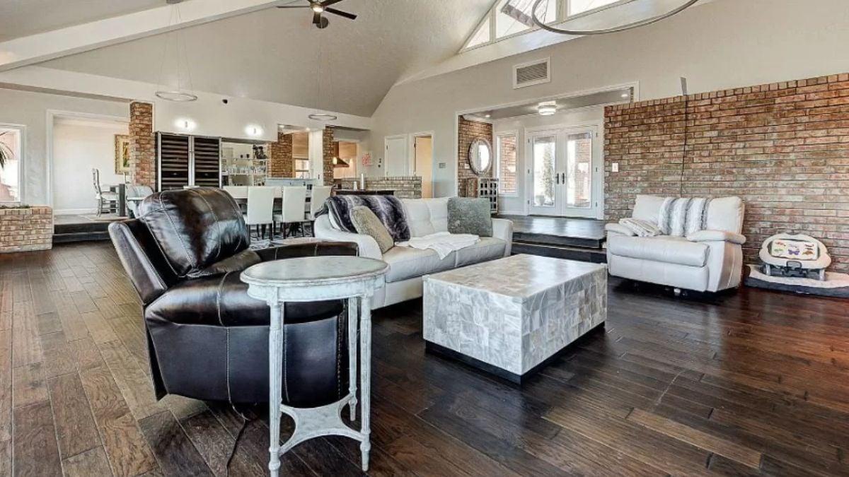 Look at the Vaulted Ceiling and Brick Details in This Open Living Space