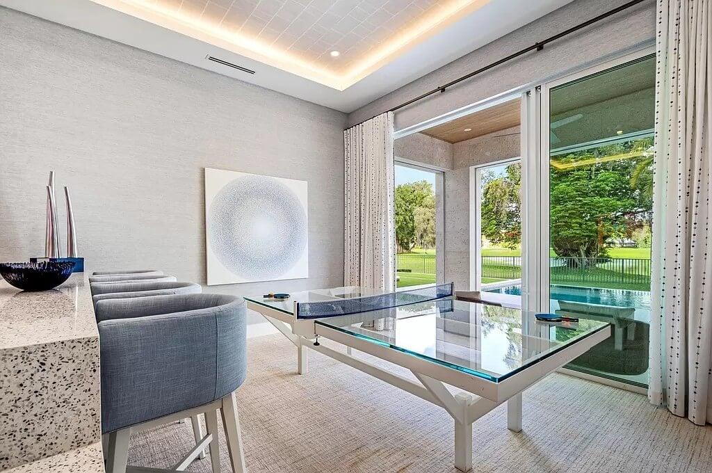 Versatile Game Room with Chic Glass Ping Pong Table