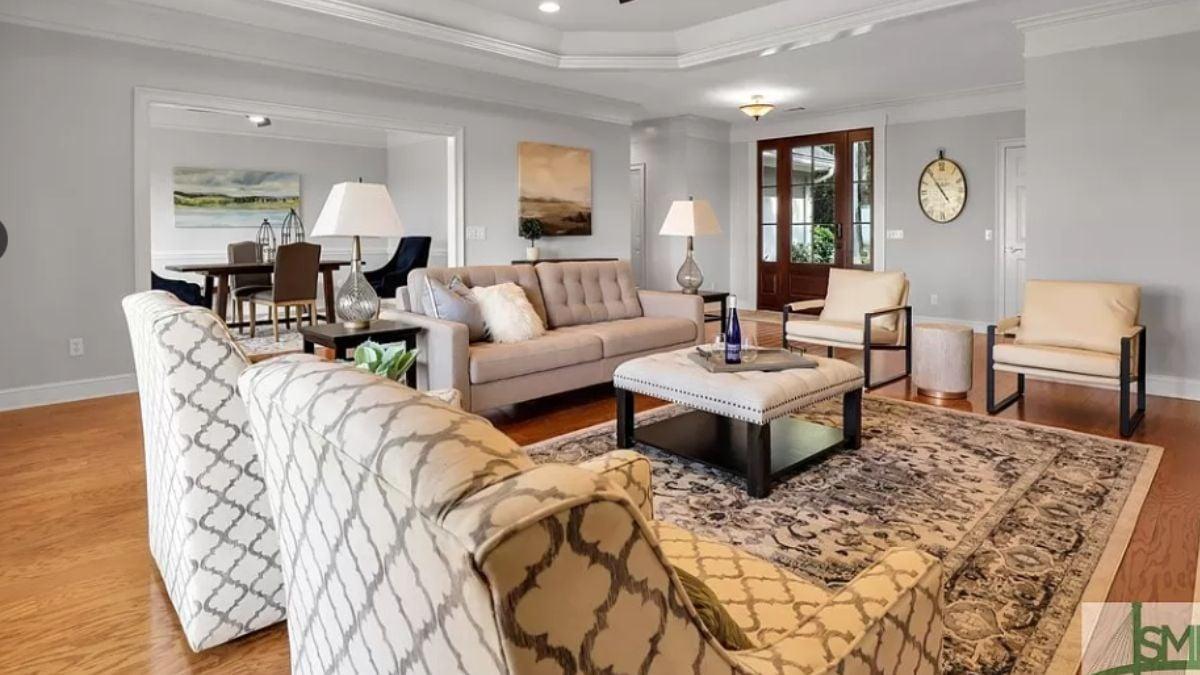 Inviting Living Room with Patterned Armchairs and Classic Coffered Ceiling