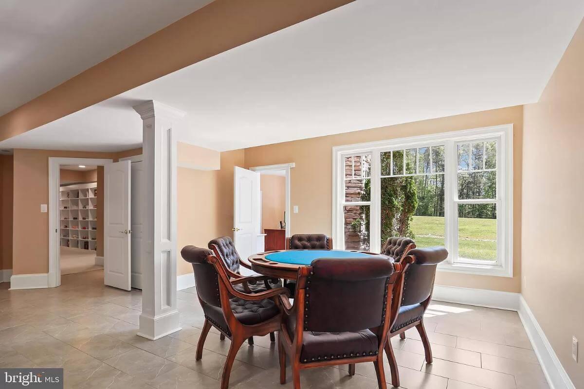 Cozy Game Room with Plush Seating and Nature Views