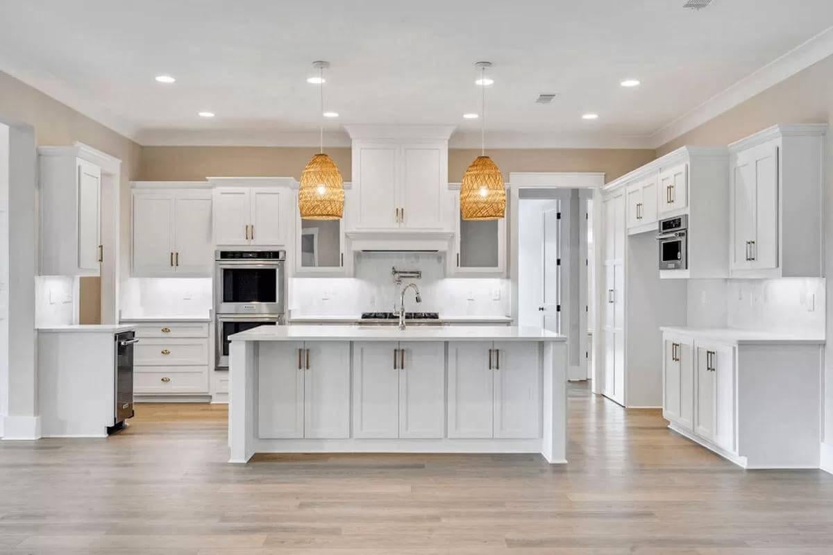 Notice the Striking Pendant Lights Over This Sleek Kitchen Island