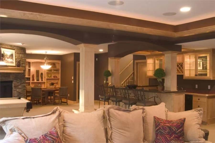 Note the Stone Fireplace in This Open-Concept Craftsman Lower Level