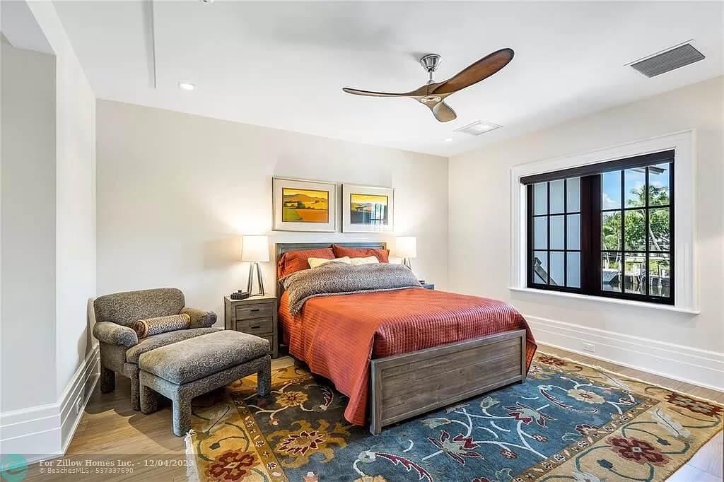 Bold Fan and Vibrant Accents Bring Life to This Relaxing Bedroom