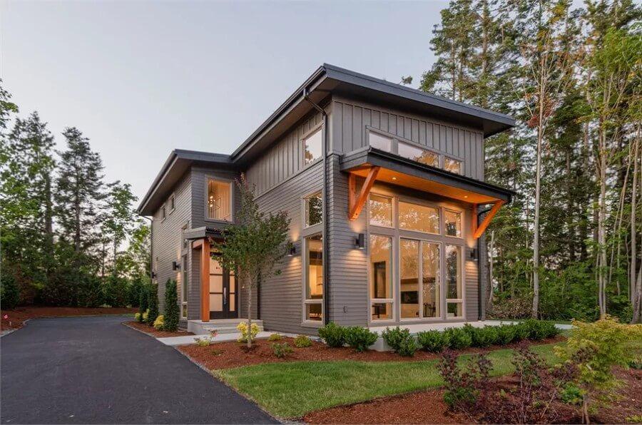 Sleek Two-Story Exterior with Eye-Catching Wooden Beam Accents