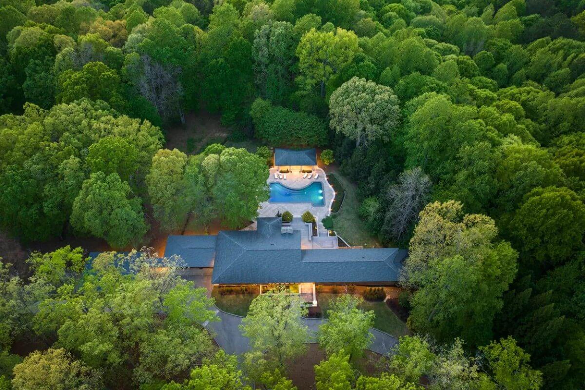 Aerial View of a Secluded Retreat with a Serene Pool Oasis