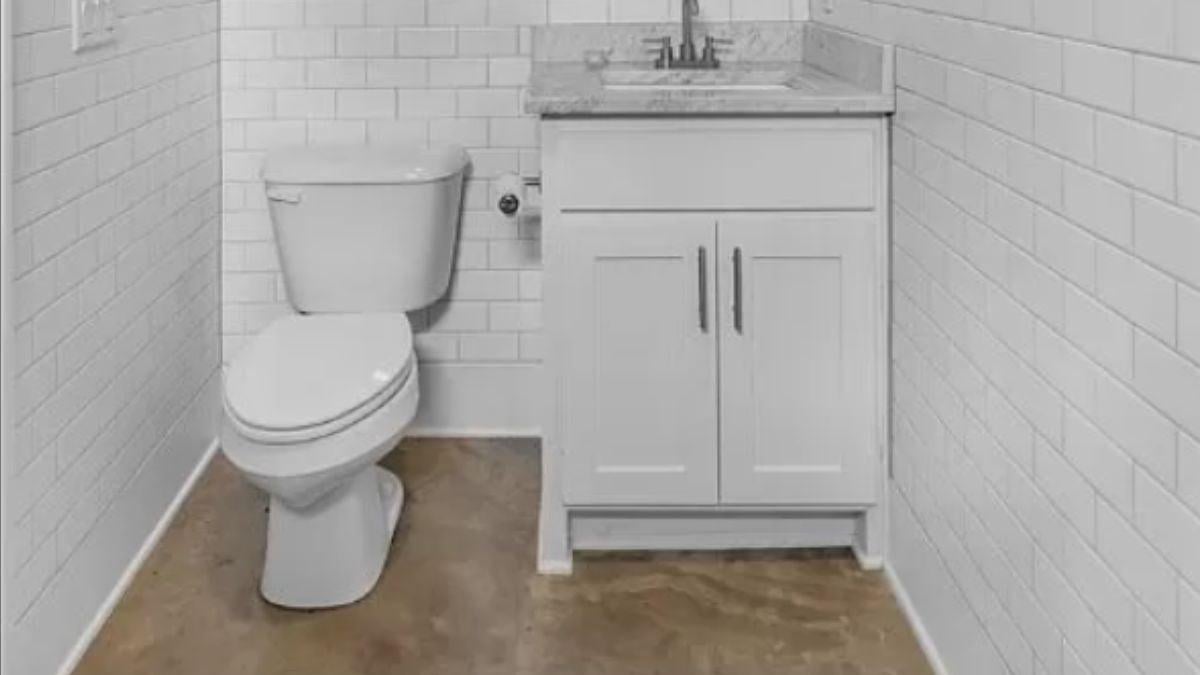 Efficient Half-Bathroom with Sleek Subway Tile