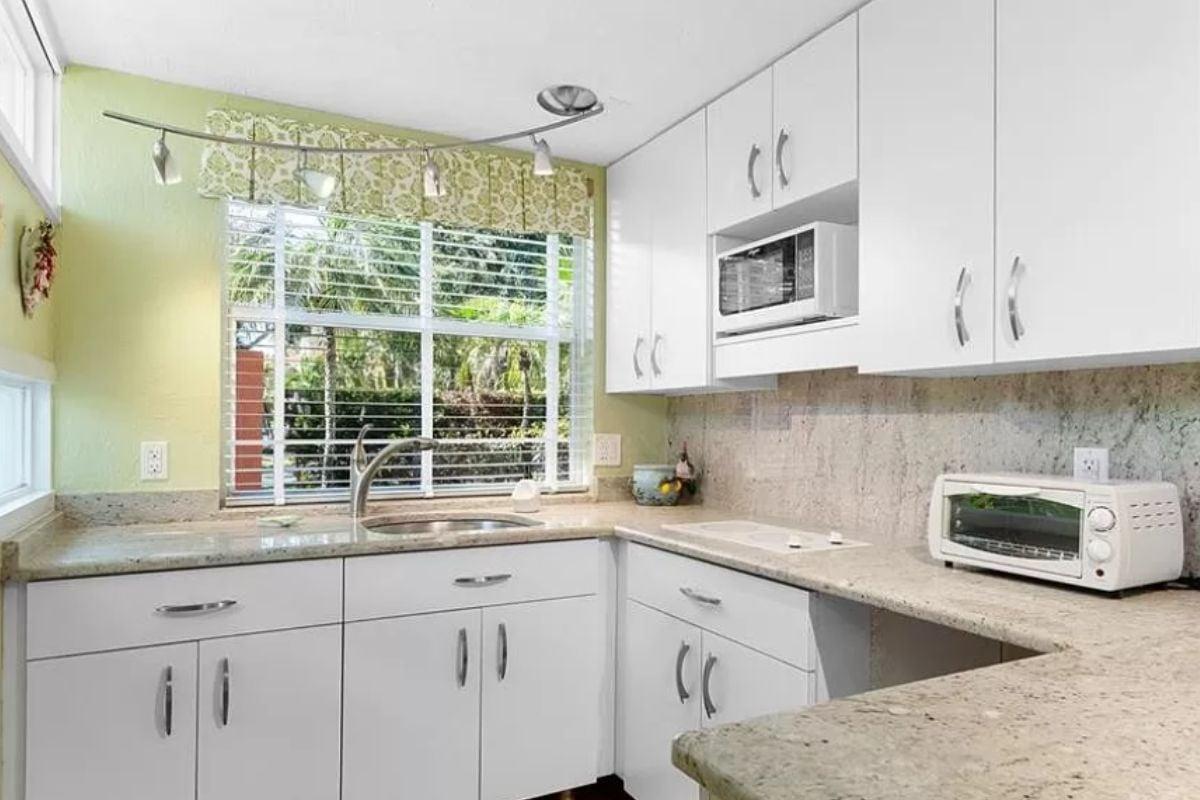 Spot the Curved Track Lighting in This Bright Kitchen Corner