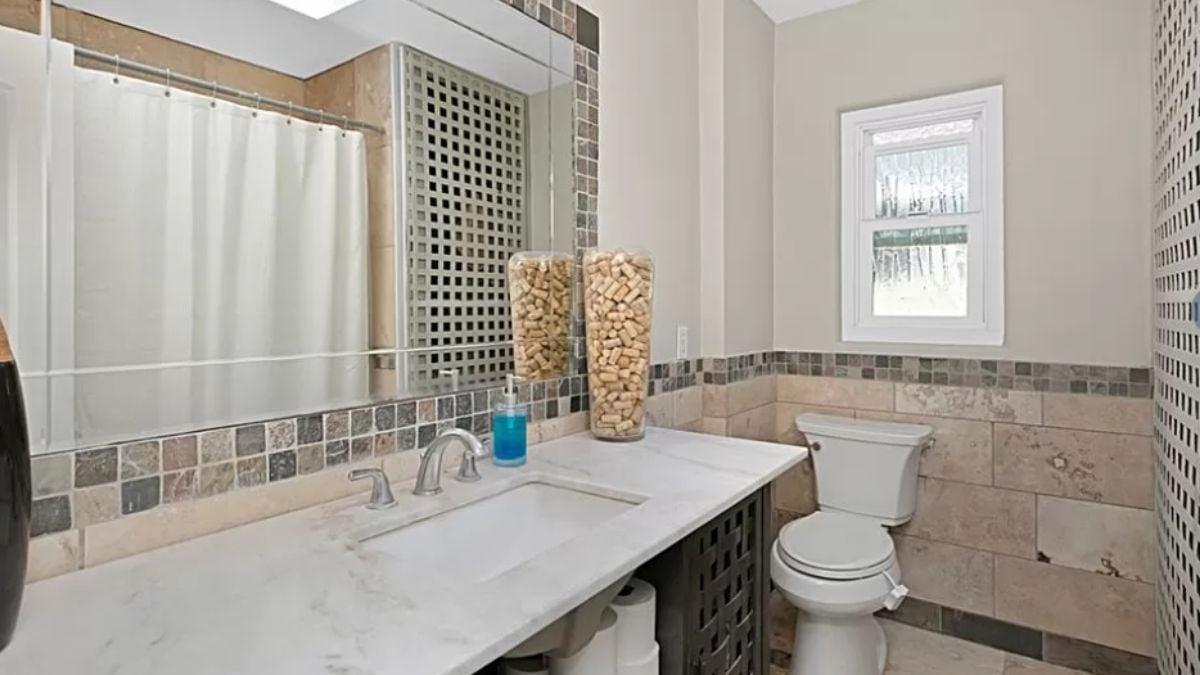 Check Out the Elegant Tile Detailing in This Sleek Bathroom