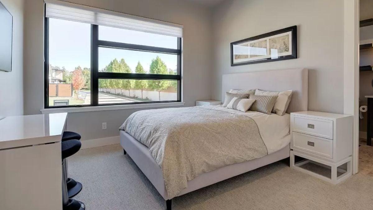 Relax in This Minimalist Bedroom with Expansive Window Views