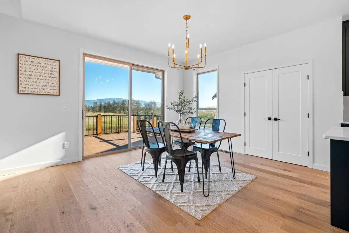 Enjoy Views Through Expansive Glass in This Dining Room