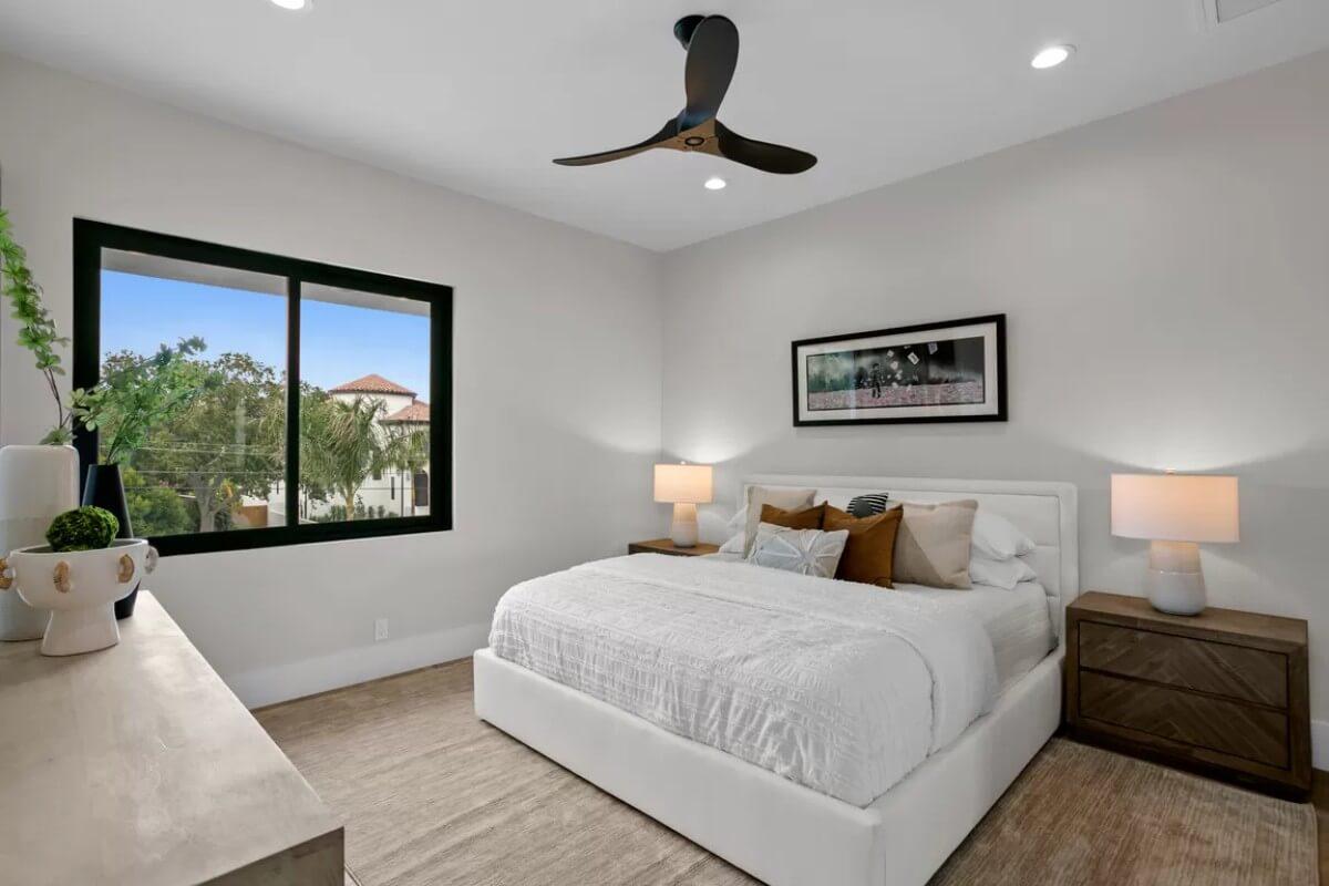 Simple Bedroom With an Elegant Ceiling Fan and Earthy Tones