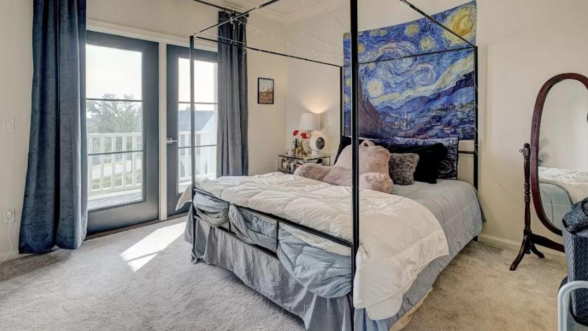 Artistic Bedroom with a Cozy Canopy Bed and Starry Night Tapestry