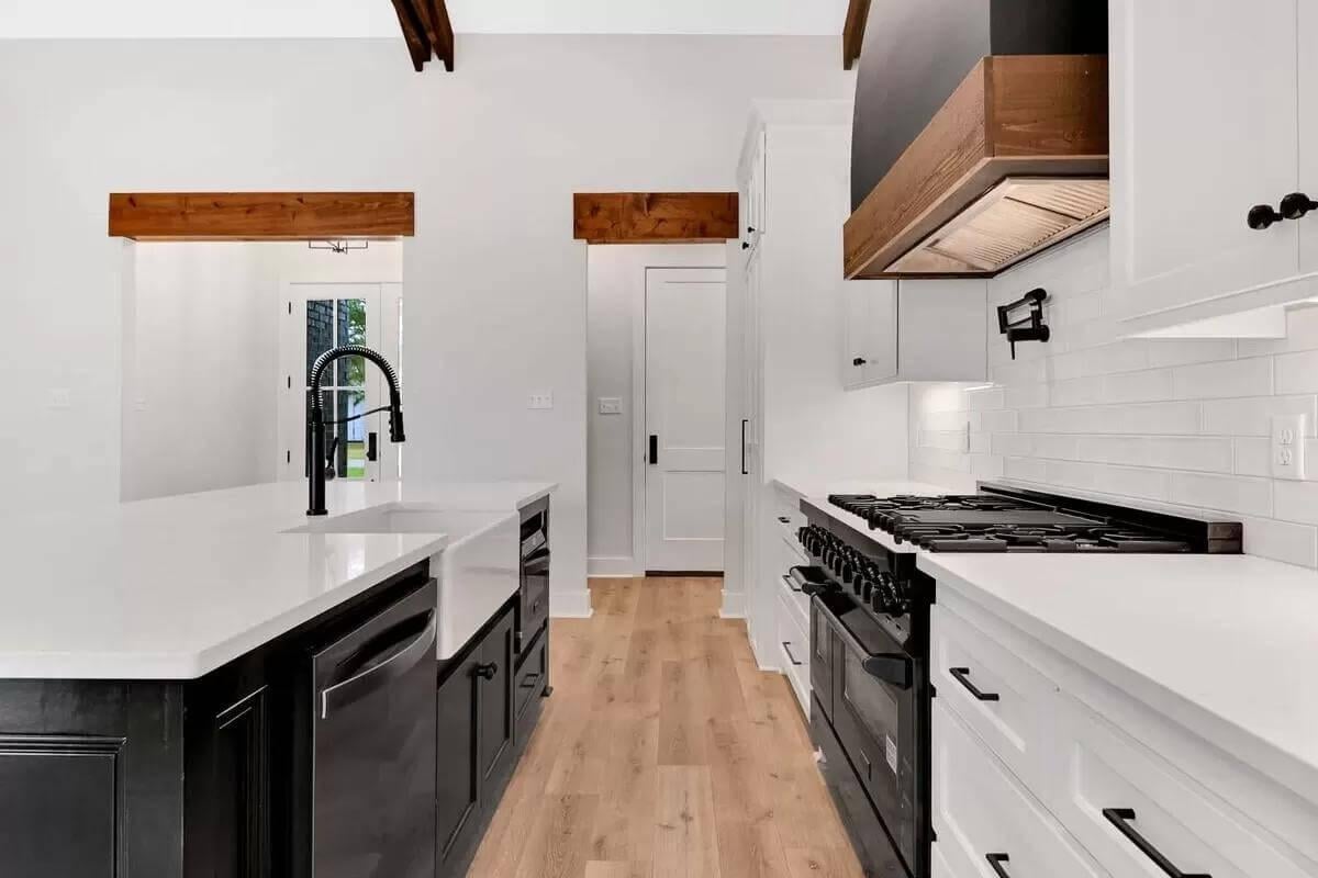 Noteworthy Black and White Contrast with a Farmhouse Sink Stealing the Show