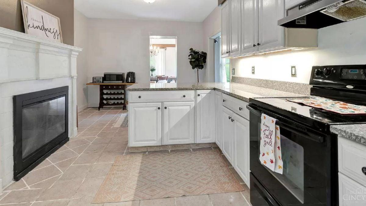 Charming Kitchen with a Fireplace and Under-Cabinet Lighting