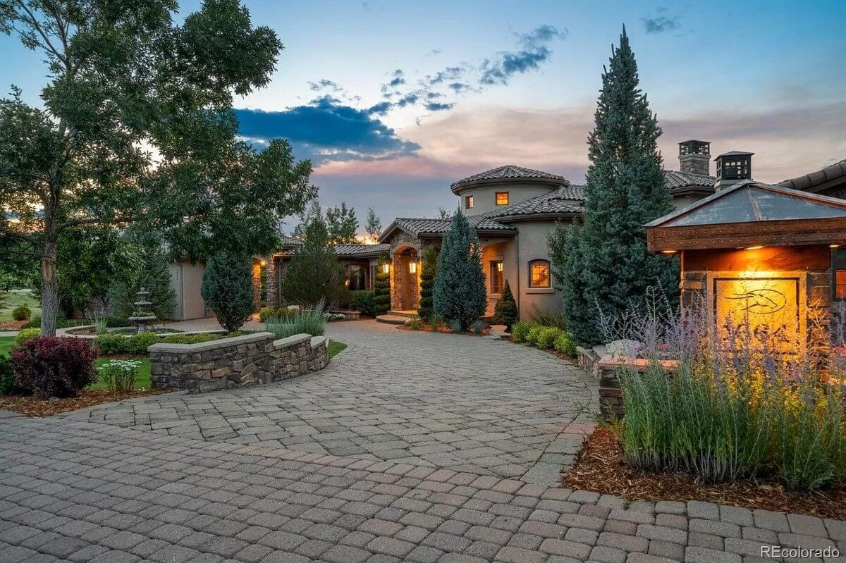 Serene Evening Exterior of a Mediterranean Villa with Stone Pathway