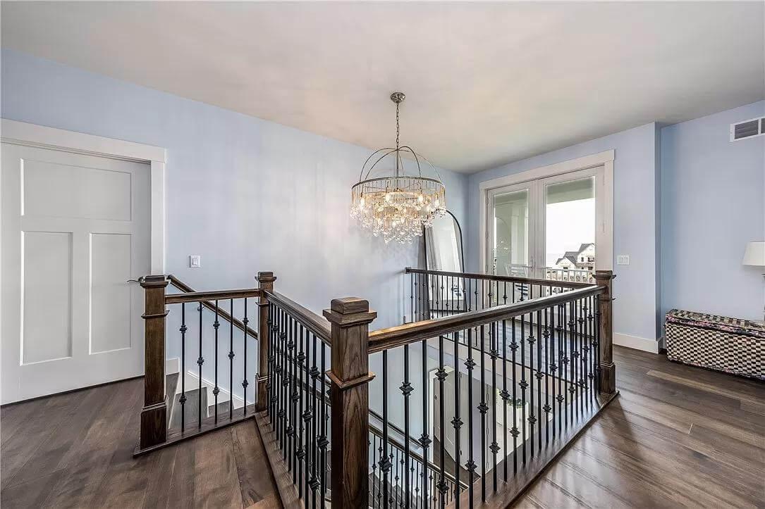 Check Out the Elegance of This Staircase with a Stunning Chandelier