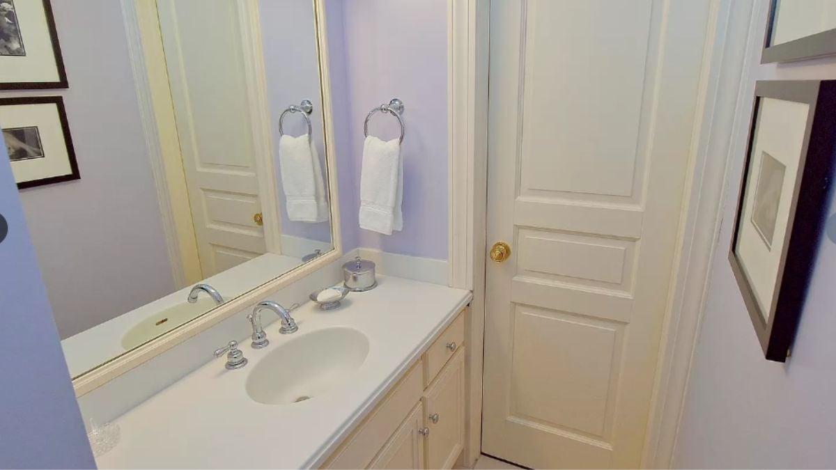 Powder Room with a Subtle Lavender Palette and Classic Fixtures