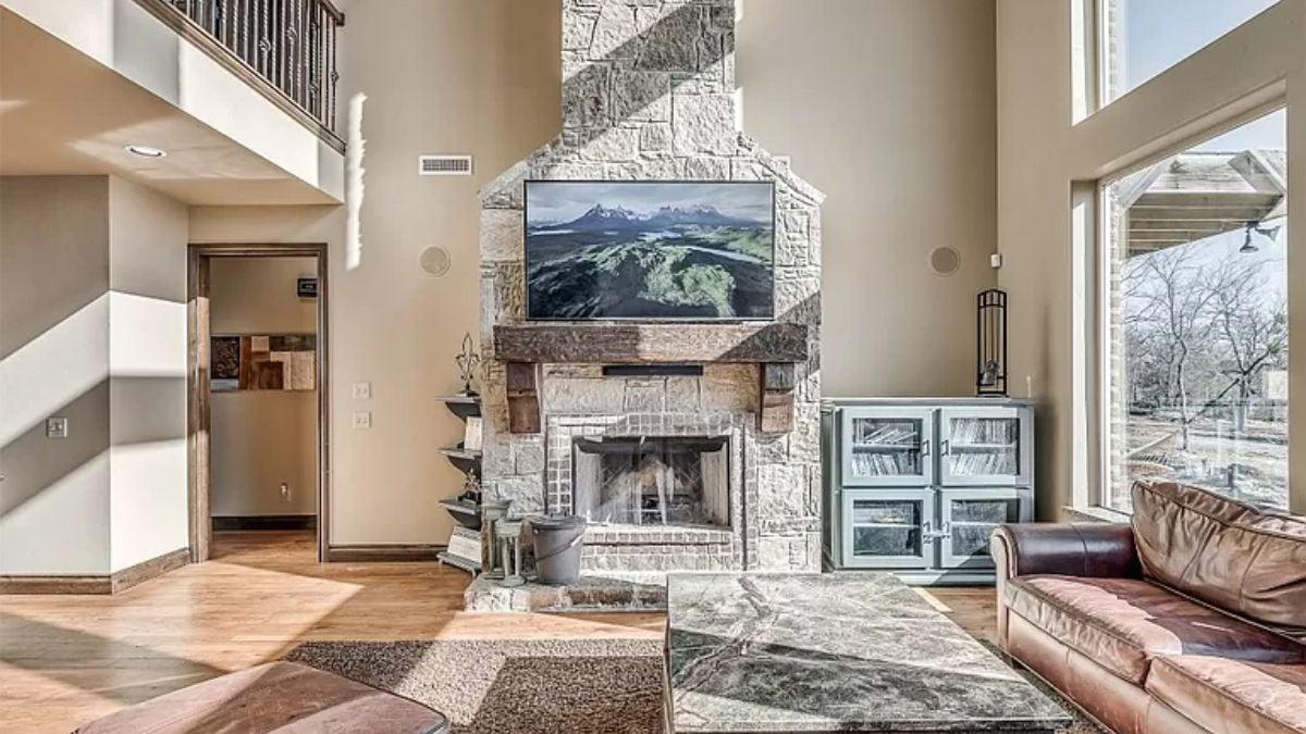 Wow, That Stone Fireplace Really Anchors This Living Room