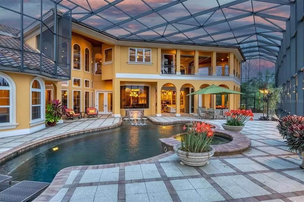 Wow, Check Out the Screened Enclosure Over This Mediterranean Pool Area