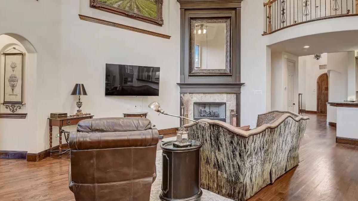Discover the Tall Fireplace Framing This Elegant Living Room