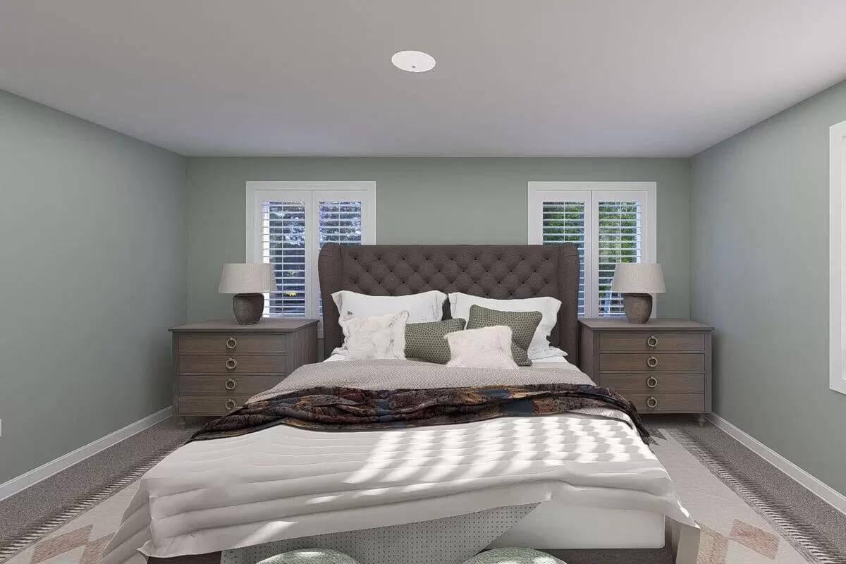 Lush Green Walls Framing a Cozy Upholstered Bed in This Craftsman Bedroom