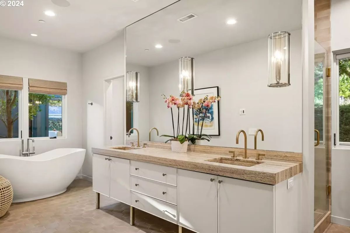 Double vanity with wood details and full wall mirror. 