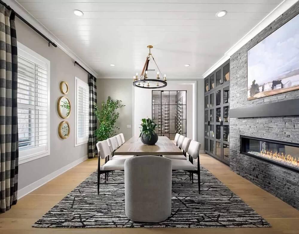 Sophisticated Dining Room with a Striking Stone Fireplace and Wine Display