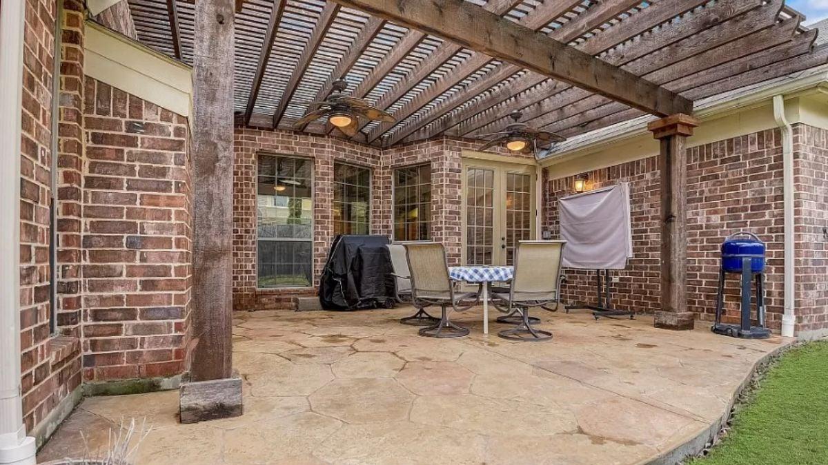 Check Out This Pergola Over a Rustic Patio Setup