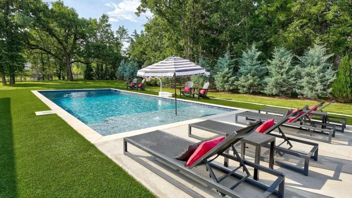 Relax by the Pool in Style Under a Striped Umbrella