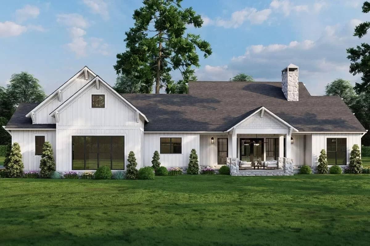 Farmhouse Beauty with Board and Batten Siding and Stone Chimney