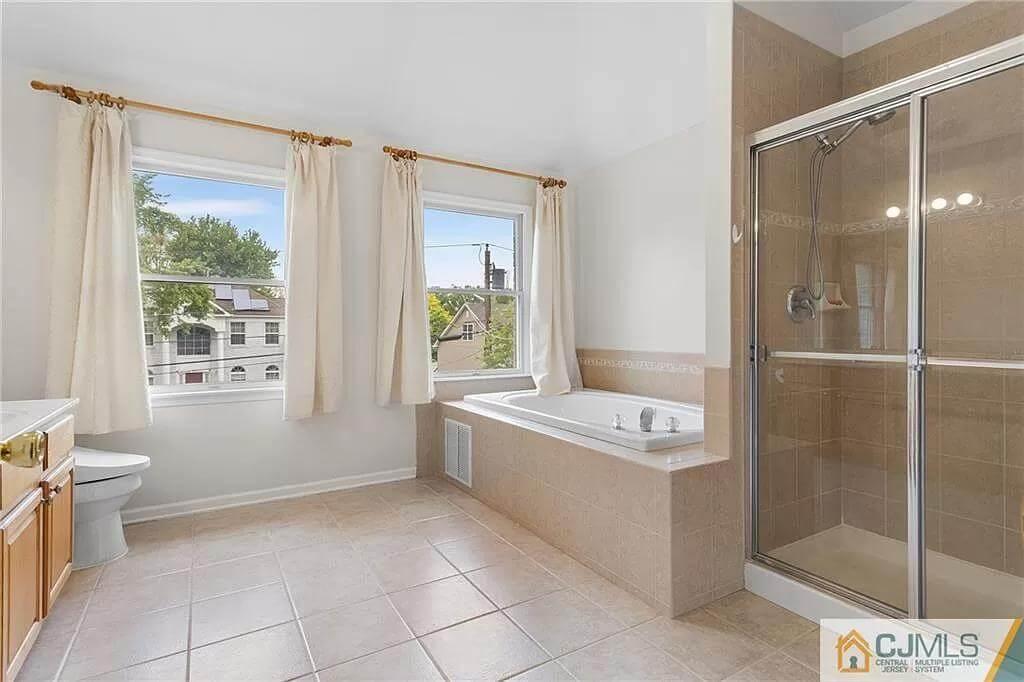 Notice the Spacious Tub in This Bright Bathroom
