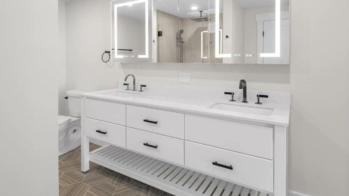 Dual Vanity Sink and LED Mirrors Add a Modern Touch
