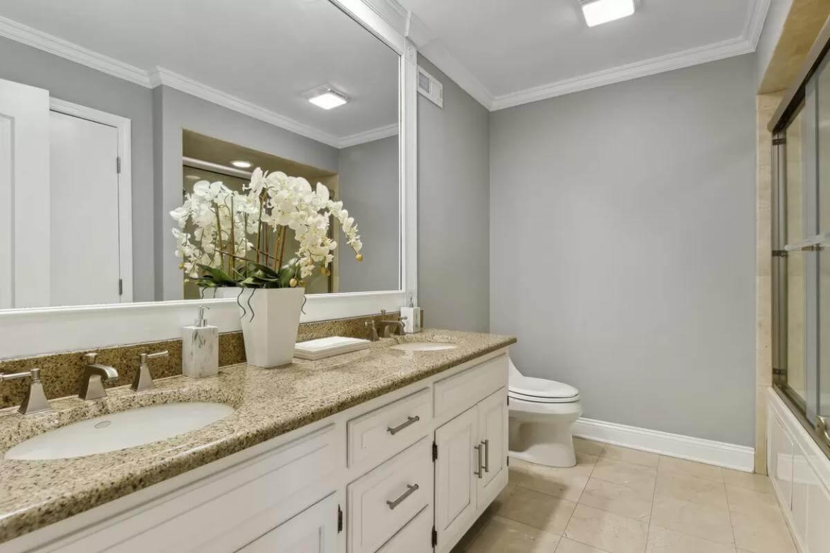 Dual Vanity with Sleek Granite Countertops Steals the Show