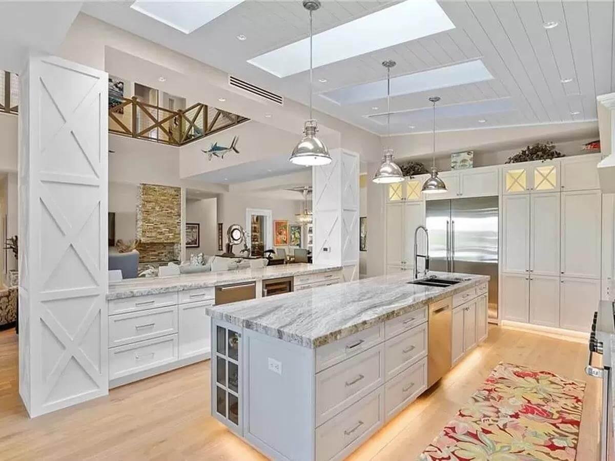 Look at This Sunlit Kitchen with Skylights and a Unique Island