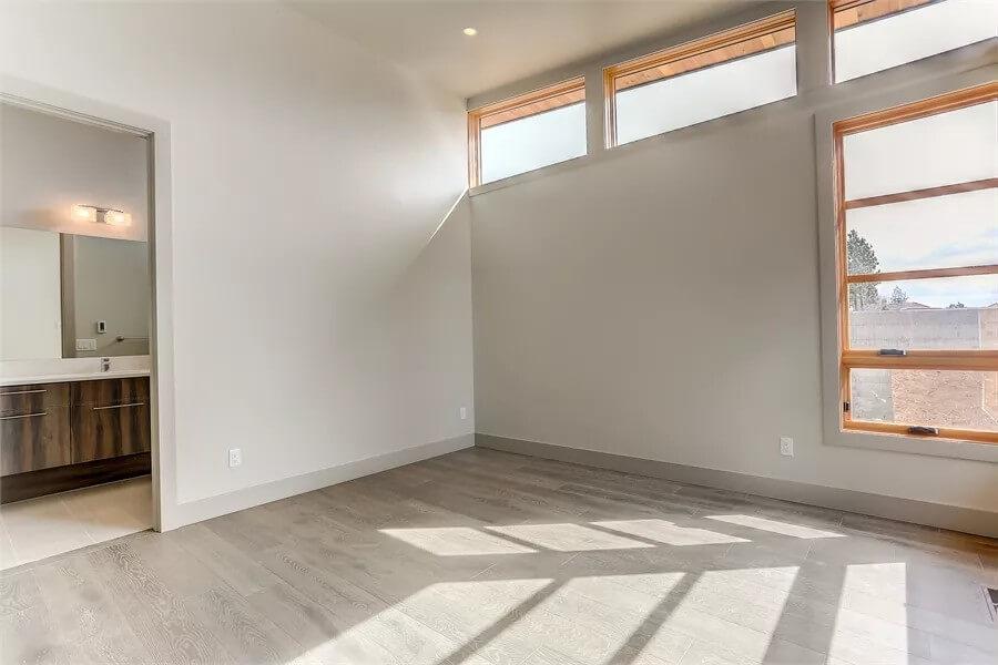 Simple Bedroom with Welcoming Natural Light and Upper Clerestory Windows
