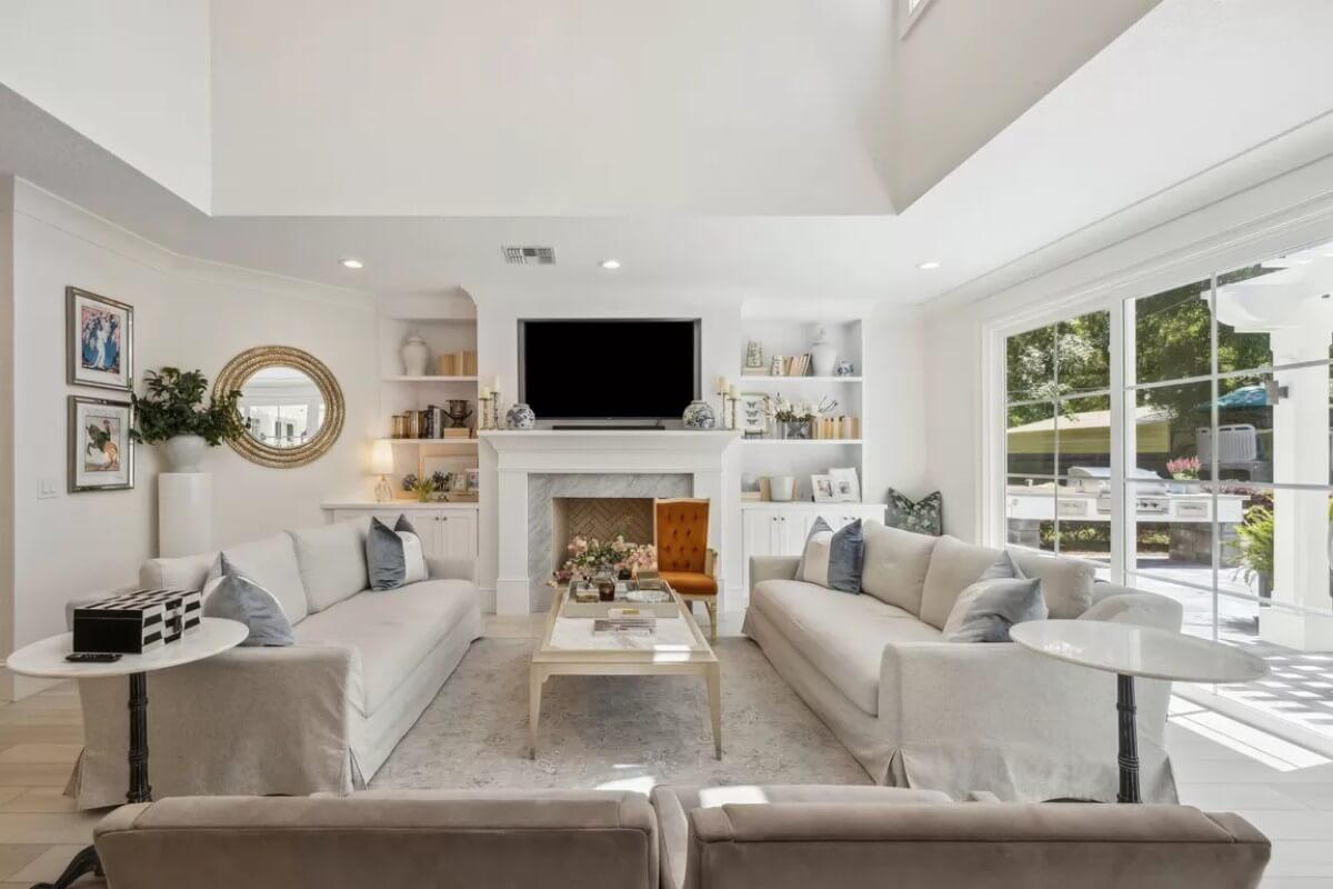 Admire the Elegant Fireplace Framed by Built-In Shelving