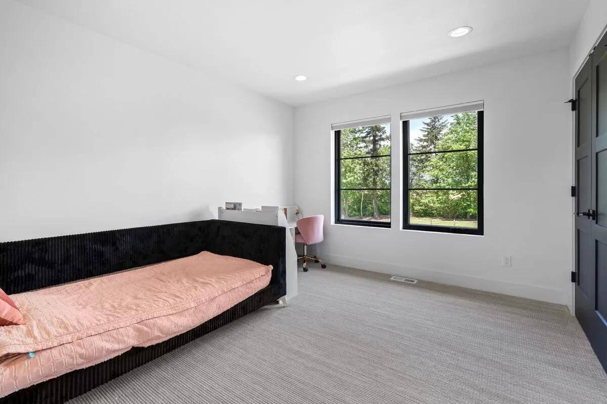 Bright Bedroom with a Pop of Pink and Sophisticated Black Framing