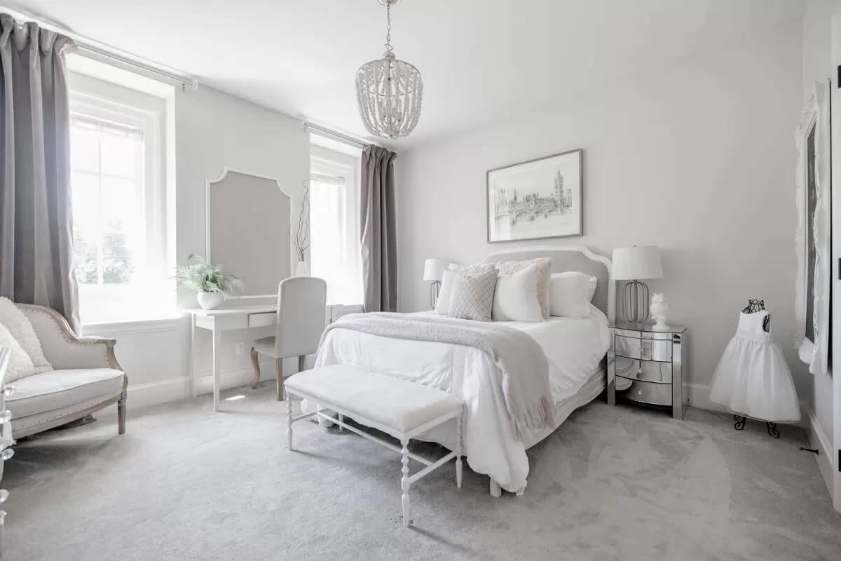 Serene Bedroom with Elegant Vanity and Dreamy Chandelier