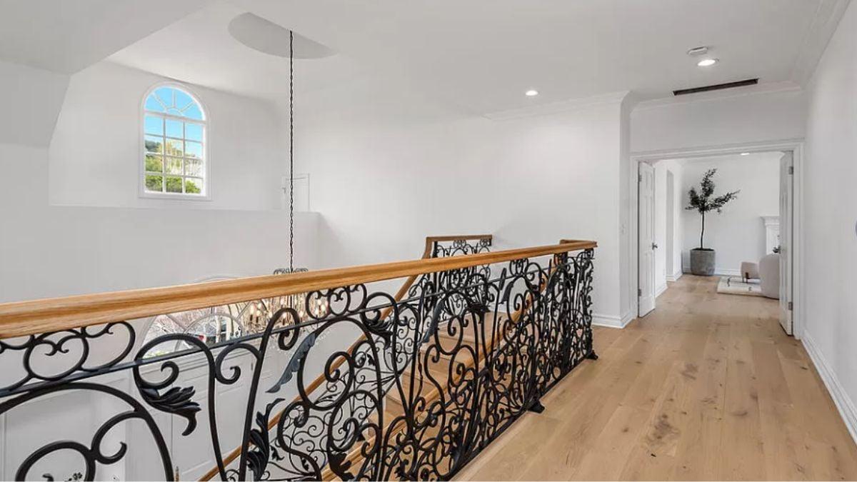 Notice the Elegant Ironwork in This Bright Upper Hallway