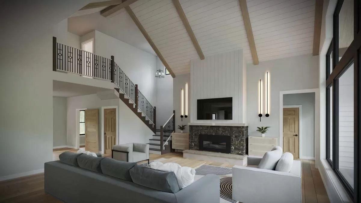 Vaulted Ceilings and Iron Railing Create a Dramatic Living Room
