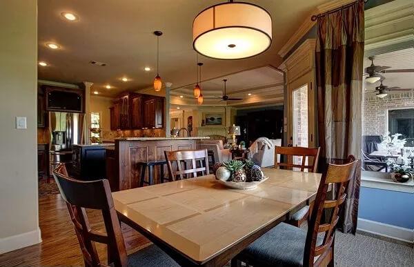 Inviting Dining Area with Warm Pendant Lighting and Open Plan Layout